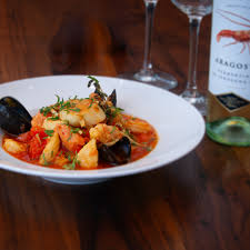 Zelo signature dishes Linguini di Mare, Chicken Parmigiana, Gelato.